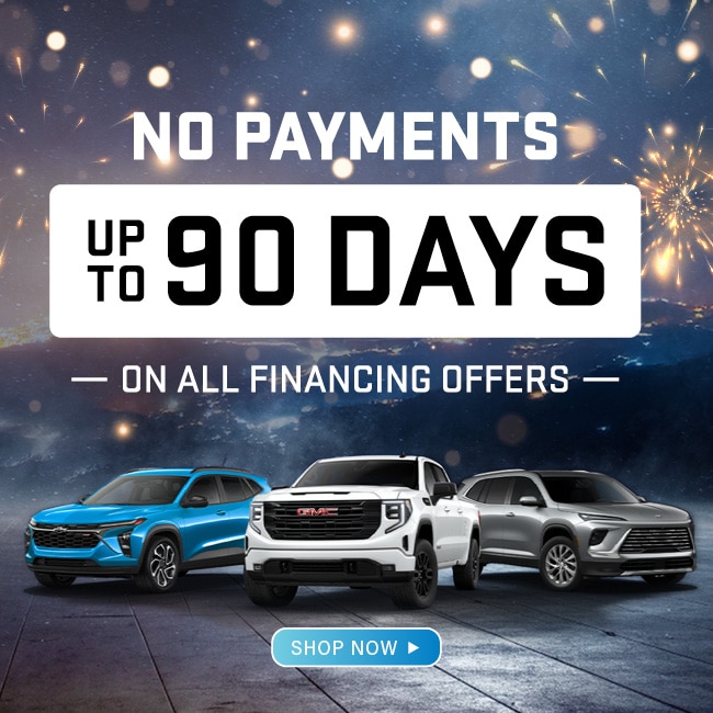 Car financing offer: No payments for up to 90 days. Features three vehicles, fireworks background.