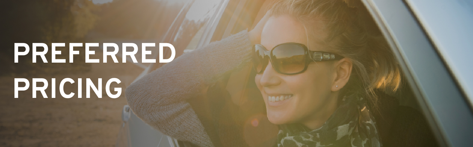 Smiling woman in sunglasses leans out car window. Text: "Preferred Pricing" on left.