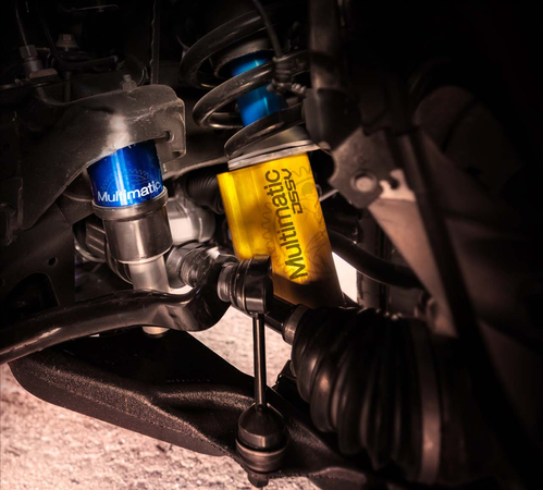 Close-up of a car's Multimatic DSSV shock absorber and suspension system components.